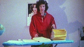 Woman standing at an ironing board with the Yellow Pages and National Geographic magazines