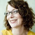 Alison Cuddy Woman wearing glasses and smiling