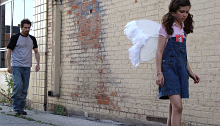 Girl wearing angel wings