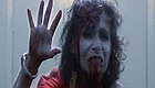 Zombie woman with blood dripping from her mouth