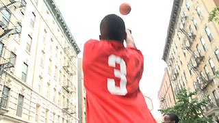 Street basketball player throws a big shot