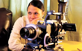 Director Jennifer Reeder directing a scene from behind her camera