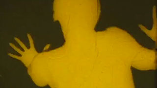 Yellow outline of a woman crawling on the floor