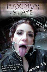 Maximum Shame Woman wearing extreme mouth gear sticks out her tongue