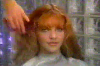 2009 Migrating Forms Trailer Red haired woman sitting in a beauty parlor chair