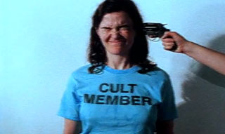 Mind Control Made Easy Cult member has a gun pointed at her head