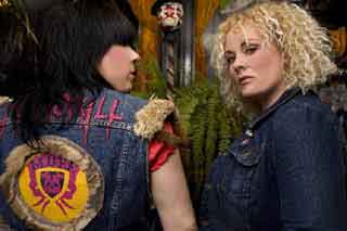 Two tough girls wearing jean jackets with a Montreal Underground Film Festival patch