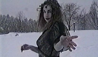 Ghostly image of a woman dances in a snowbank