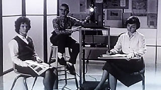 Re-presenting Prelinger Three students sitting around a school movie projector