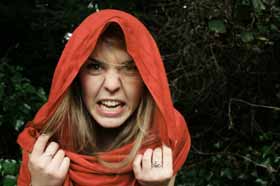 An angry Christina Wood wearing a red hood