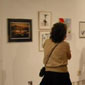 Woman looking at artwork in a gallery