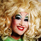 Portrait of Peaches Christ with a giant blond wig