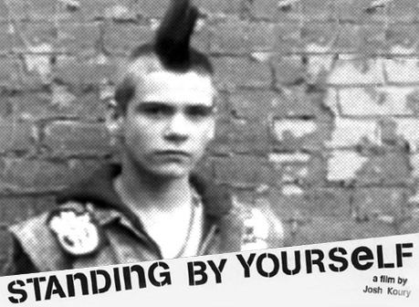 B&W photo of a teenage punk with a mohawk from Josh Koury's Standing By Yourself documentary
