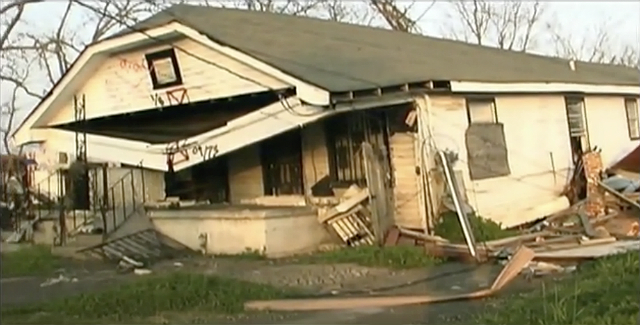 A collapsing house in the aftermath of Hurricane Katrina