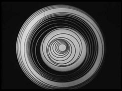 Still from Anemic Cinema featuring a circular abstract image