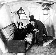 Still from The Cabinet of Dr. Caligari where Caligari greets Cesare rising from coffin