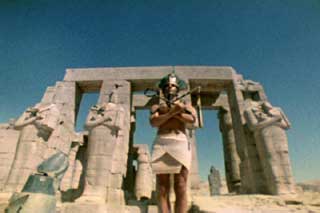 Film still of Lucifer Rising by Kenneth Anger featuring a Pharoh in front of ruins
