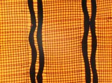 Film still from Colour Cry featuring abstract squiggly lines on a plaid background