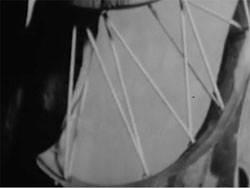 Film still from Visual Variations on Noguchi featuring bike wheel spokes