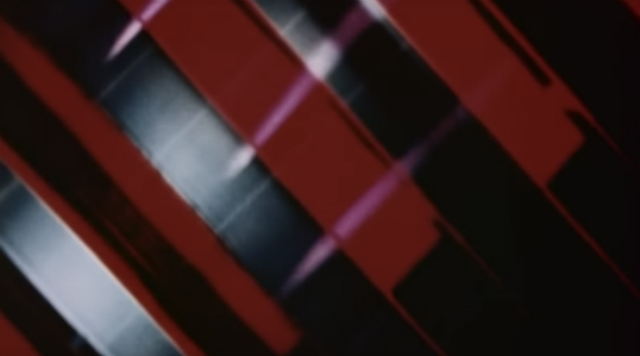 Turn Turn Turn Abstract ribbons of red and silver from an experimental film by Jud Yalkut