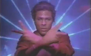 Philip Michael Thomas in front of a music video background