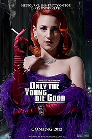 Sexy redhead in purple dress smoking cigarette